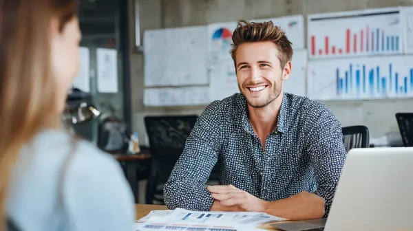 a-young-financial-advisor-sitting-at-a-modern-desk.png